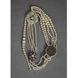 FRENCH FOUR STRAND NECKLACE OF IMITATION PEARLS with two large paste set spacers and clasp