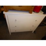 A WHITE FINISH CHEST OF THREE LONG DRAWERS WITH FACETED GLASS KNOB HANDLES, 2’11” WIDE