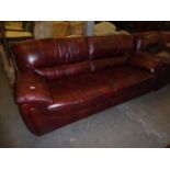A LOUNGE SUITE OF TWO PIECES COVERED IN TAN LEATHER, VIZ A THREE SEATER SETTEE AND A TWO SEATER