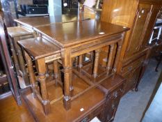 A HEAVY QUALITY NEST OF THREE JACOBEAN STYLE OAK COFFEE TABLES, THE LARGER OBLONG TABLE 2’1” LONG