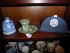 A WEDGWOOD BLUE JASPERWARE MANTEL CLOCK, TWO PIECES of WEDGWOOD SAGE GREEN JASPERWARE, and A