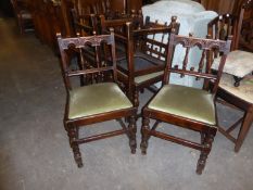 A SET OF SIX 17TH CENTURY STYLE CARVED OAK ‘DERBYSHIRE’ DINING CHAIRS, WITH DROP-IN SEATS, COVERED