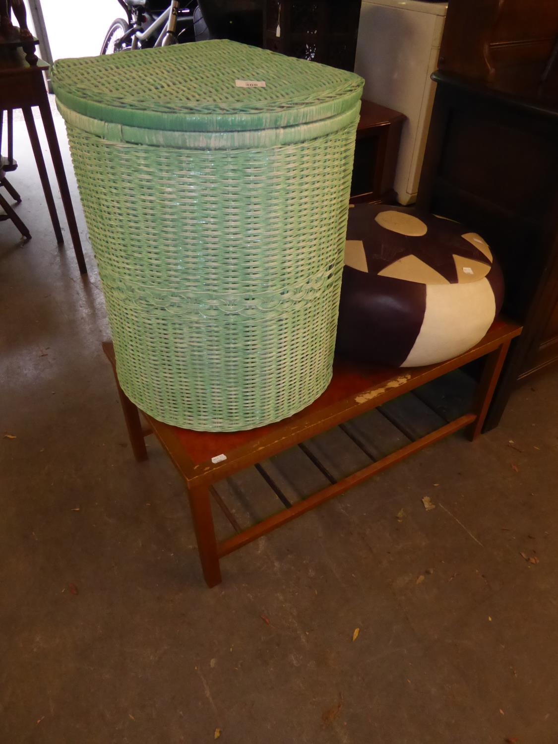 A GREEN LOOM CORNER LINEN RECEIVER; A BROWN AND CREAM LEATHER POUFFE AND AN OBLONG COFFEE TABLE WITH