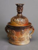 CIRCA 1840 LAMBETH STYLE BROWN GLAZED STONEWARE TWO HANDLED TOBACCO JAR, with cover as a candle