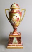 POST 1862 VIENNA PORCELAIN TWO HANDLED PEDESTAL VASE WITH DOMED COVER, the richly gilded claret