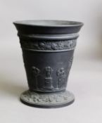 EARLY TWENTIETH CENTURY WEDGWOOD MOULDED BLACK BASALT VASE, of tapering form, decorated with