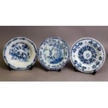 THREE EIGHTEENTH CENTURY BLUE AND WHITE DELFT POTTERY PLATES, including an English Chinoiserie