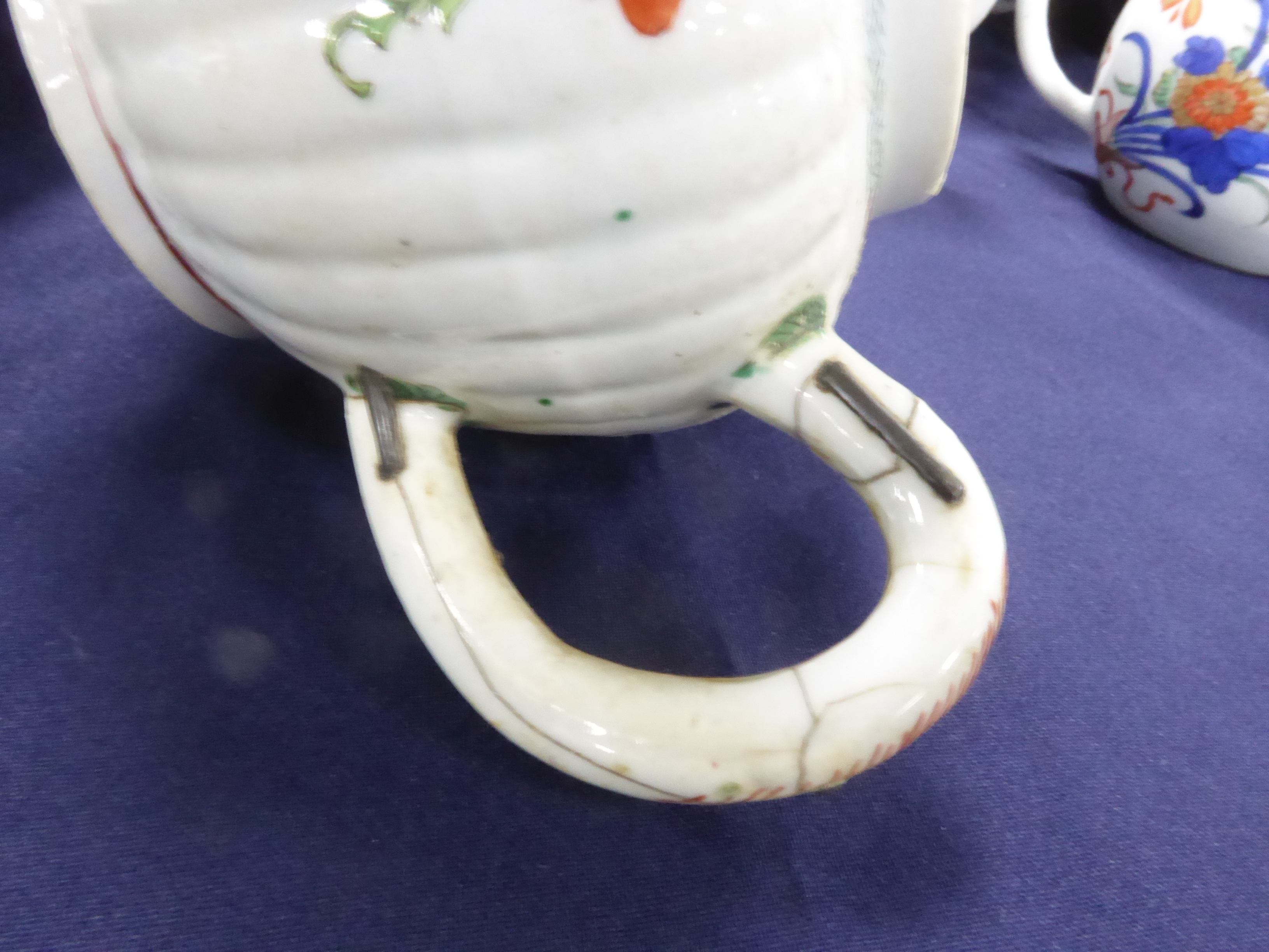 FOUR CHINESE MID QING DYNASTY PORCELAIN TEAPOTS, one with replaced white metal spout, one with metal - Image 11 of 14