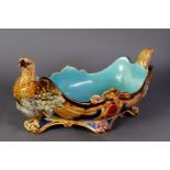 SARREGUEMINES, FRENCH MOULDED MAJOLICA POTTERY BOAT SHAPED DISH, modelled with eagles to the ends,