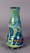 WILLIAM MOORCROFT FOR LIBERTY & Co, CLAREMONT PATTERN TUBE LINED POTTERY VASE, of slender double