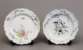 FOUR 18th CENTURY CONTINENTAL FAYENCE PLATES, polychrome enamelled with flowers, parakeets and