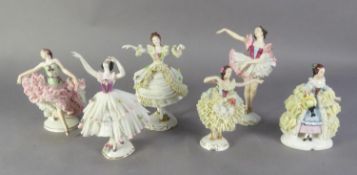 FOUR 20th CENTURY GERMAN PORCELAIN FIGURES OF BALLET DANCERS with fine detail costume in net, the