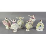 FOUR 20th CENTURY GERMAN PORCELAIN FIGURES OF BALLET DANCERS with fine detail costume in net, the