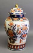 20th CENTURY ORIENTAL PORCELAIN INVERTED BALUSTER SHAPE COVERED JAR, decorated in an Imari