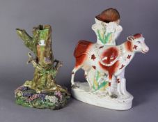 VICTORIAN STAFFORDSHIRE POTTERY STANDING COW SPILL HOLDER GROUP, the cow with iron red detail and