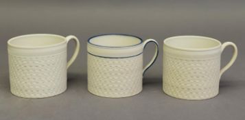 PAIR OF NINETEENTH CENTURY WEDGWOOD OZIER ENGINE TURNED WHITE STONEWARE MUGS, of typical form,