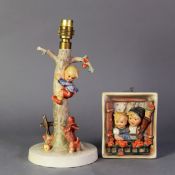 GOEBEL HUMMEL CERAMIC TABLE LAMP OF TYPICAL FORM, boy up an apple tree, barking terrier below,