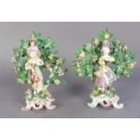 MATCHED PAIR OF 18th CENTURY BOW PORCELAIN BOY AND GIRL BOCAGE FIGURES, on turquoise blue and puce