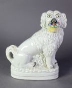 NICELY MODELLED VICTORIAN STAFFORDSHIRE POTTERY MANTEL DOG, with flower basket in its mouth and one