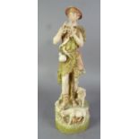 INTER-WAR YEARS ROYAL DUX FIGURE OF A SHEPHERD playing a flute with two sheep at his feet,