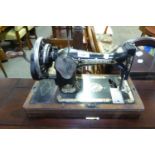 SINGER MANUAL PORTABLE SEWING MACHINE AND A MILESTONE SHAPED WALL MIRROR (2)