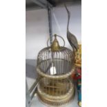VICTORIAN STYLE SMALL BRASS BIRD CAGE, CIRCULAR AND DOME TOPPED AND MOUNTED WITH THE FIGURE OF A
