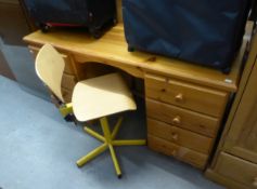 A MODERN PINE DOUBLE PEDESTAL DESK, WITH EIGHT DRAWERS, 4'6" X 1'6" AND A BENTWOOD STYLE REVOLVING