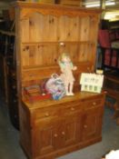 A PINE WELSH DRESSER, WITH RAISED PLATE RACK