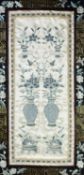 CHINESE EMBROIDERED SILK PANEL, decorated with six urns of flowers in blue and white on a grey