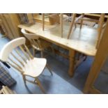 A SET OF SIX WINDSOR BLOND HARDWOOD DINING CHAIRS, INCLUDING TWO CARVERS ARMCHAIRS, WITH RAIL