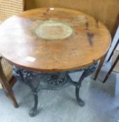 A CAST IRON BRITANNIA PUB TABLE, WITH CIRCULAR WOODEN TOP (TOP CRACKED) 75.5cm high X 62cm diameter