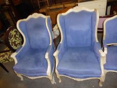 A PAIR OF SIMILAR WINGED EASY CHAIRS