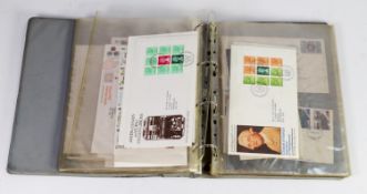 GREY RING BINDER CONTAINING 31 MAINLY 1980s FIRST DAY COVERS of which 7 are new value definitive