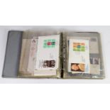 GREY RING BINDER CONTAINING 31 MAINLY 1980s FIRST DAY COVERS of which 7 are new value definitive