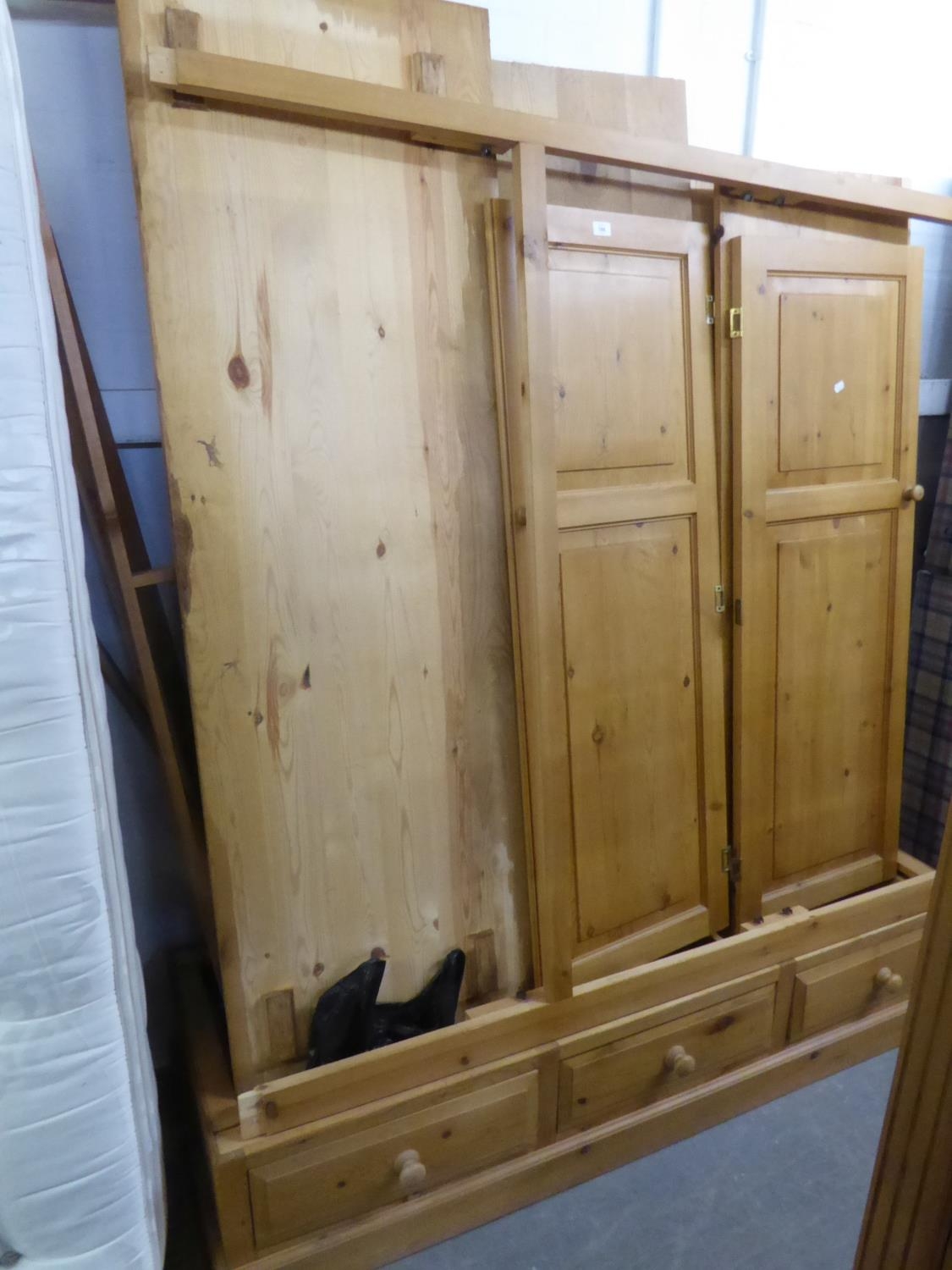 GOOD QUALITY LARGE PINE THREE DOOR WARDROBE HAVING 3 DRAWER BASE WITH KNOB HANDLES, 195cm high x