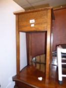 AN OAK FLOOR STANDING SEWING BOX, WITH HINGED LID, ON STRAIGHT LEGS