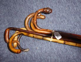 SEVEN VINTAGE WALKING CANES, including one with 18ct gold plated collar, and another with hallmarked