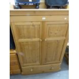 A TWO DOOR AND 1 DRAWER PINE CABINET TALL BOY