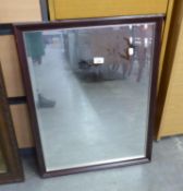 AN OBLONG WALL MIRROR, IN NARROW FRAME