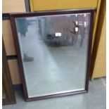 AN OBLONG WALL MIRROR, IN NARROW FRAME