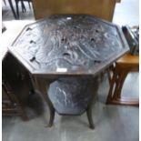 A DARKWOOD OCTAGONAL OCCASIONAL TABLE, HAVING CARVED DRAGON DESIGN TOP AND UNDERTIER (top 59cm x