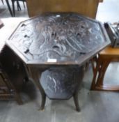 A DARKWOOD OCTAGONAL OCCASIONAL TABLE, HAVING CARVED DRAGON DESIGN TOP AND UNDERTIER (top 59cm x