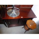 A MAHOGANY CUPBOARD, ENCLOSED BY TWO SLIDING PANEL DOORS, ON PLINTH BASE, 3’5” WIDE AND A MAHOGANY