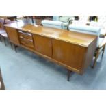 A MID-CENTURY TEAK LONG, LOW SIDEBOARD, damage to the top left corner of the bottom drawer