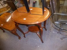 LATE VICTORIAN WALNUT OCCASIONAL TABLE with oval top and moulded cabriole legs tied by a