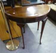 A MAHOGANY DEMI-LUNE FLAP TOP CARD TABLE, ON SEMI-CABRIOLE LEGS