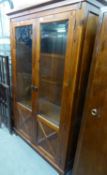A MAHOGANY DISPLAY CABINET, ENCLOSED BY TWO GLAZED DOORS WITH PANELLED LOWER PORTION, 3’5” WIDE, 5’