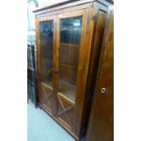 A MAHOGANY DISPLAY CABINET, ENCLOSED BY TWO GLAZED DOORS WITH PANELLED LOWER PORTION, 3’5” WIDE, 5’