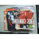 SELECTION OF LATE 1990s MANCHESTER UNITED REVIEW FOOTBALL PROGRAMMES AND A SELECTION OF RELATED