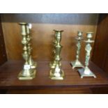 PAIR OF EARLY 20th CENTURY CAST BRASS FEMALE FIGURAL CANDLESTICKS ON SQUARE BASES WITH CORNER